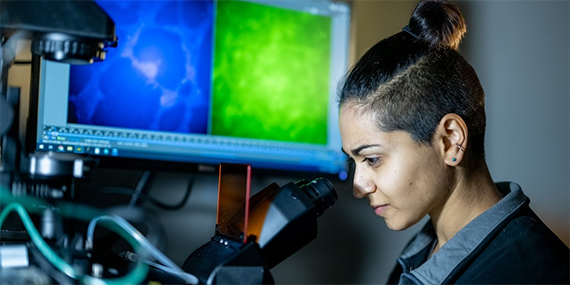 Scientist at a microscope